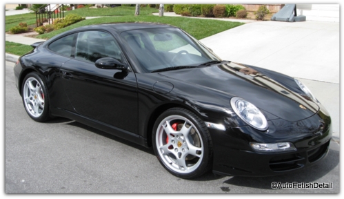waxing a black car porsche